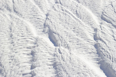 White texture of pamukkale calcium travertine in turkey, diagonal pattern of the feathers close-up.