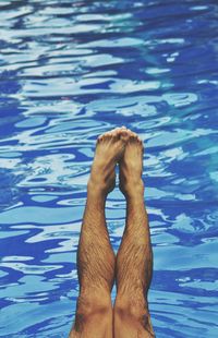 Low section of woman in swimming pool