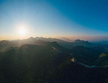 View of the great wall and mountains at sunset