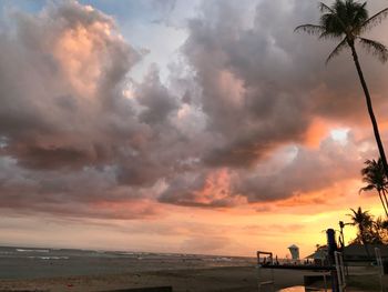 Scenic view of beach against sky during sunset