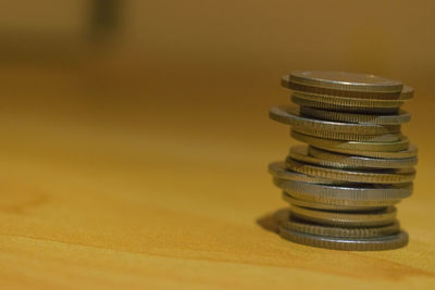 Close-up of coins on table