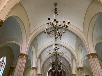 Low angle view of chandelier hanging in building