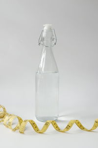 Close-up of empty glass bottle on table
