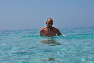 Portrait of man swimming in sea