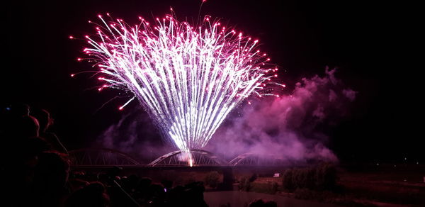 Firework display at night