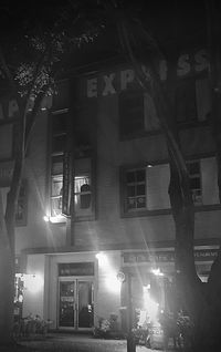 Low angle view of illuminated buildings at night