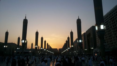 Panoramic view of city buildings against sky during sunset