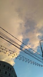 Low angle view of cables against sky