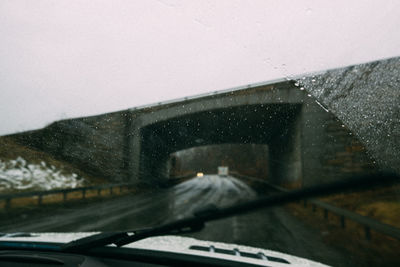 Cropped image of car on road