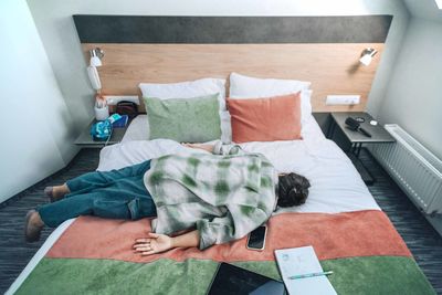 Student fallen asleep amidst their study materials, highlighting intense demands of academic life