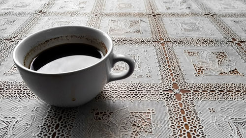 High angle view of coffee cup on table