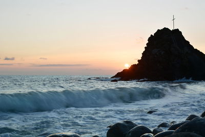 Scenic view of sea against sky during sunset