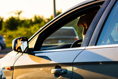 Reflection of car on side-view mirror