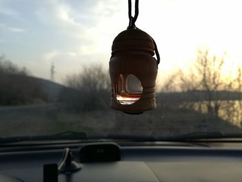 Close-up of car on road against sky