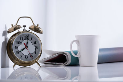 Close-up of clock on table