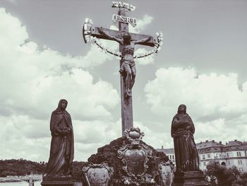 Low angle view of statue against cloudy sky