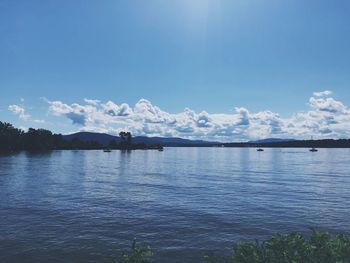 Scenic view of lake against blue sky