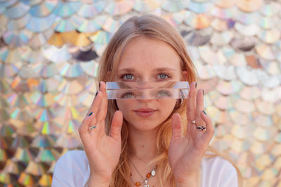 Portrait of young woman holding crystals