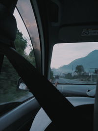 Reflection of sky seen through car window