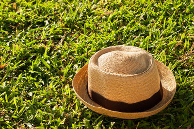 High angle view of hat on grassy field