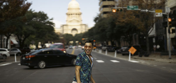 Man walking in front of texas capital 