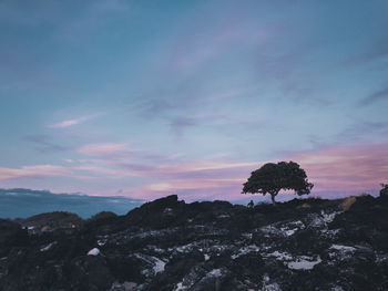 Scenic view of mountains against sky at sunset