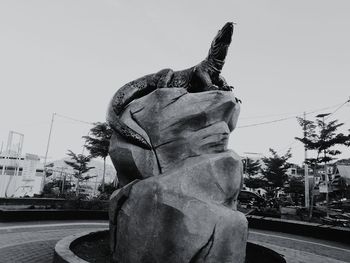 Low angle view of statue against sky