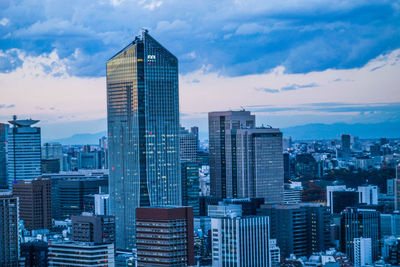 Modern buildings in city against sky
