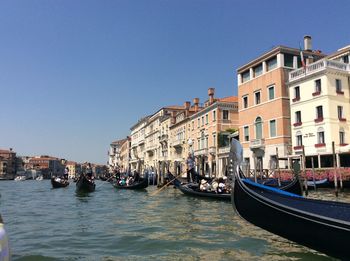 Boats moored in canal