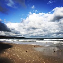 Scenic view of beach against sky