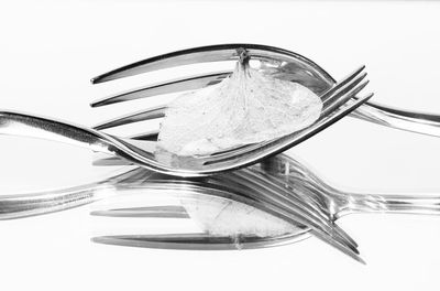 High angle view of glass on table against white background