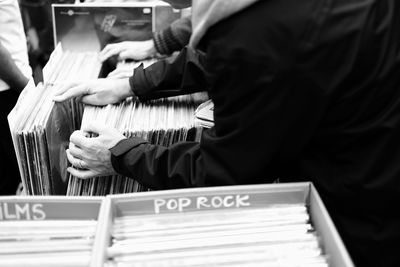 Men selecting records at store