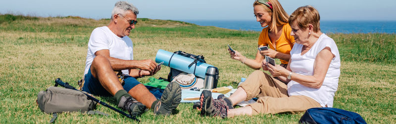 Friends sitting on field