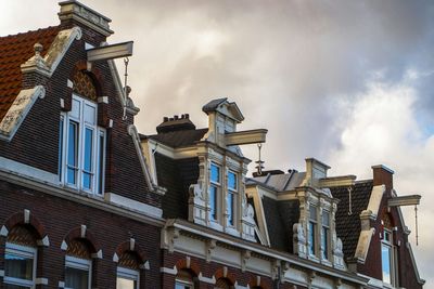 High section of traditional houses against cloudy sky