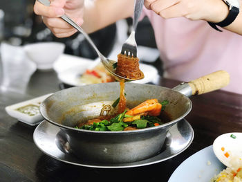 Midsection of man preparing food