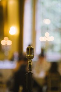 Close-up of microphone in illuminated room