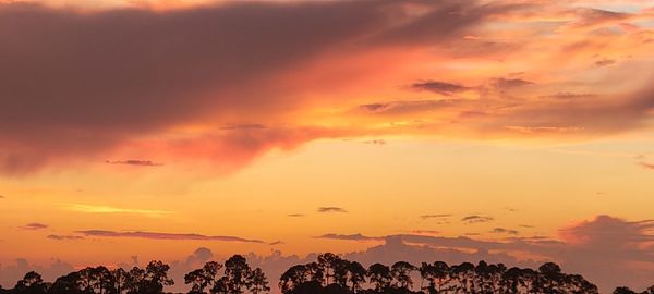 Scenic view of dramatic sky during sunset