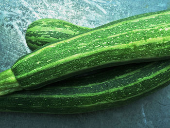 Close-up of zucchinis on table