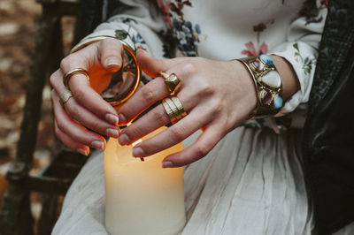 Midsection of woman holding hands