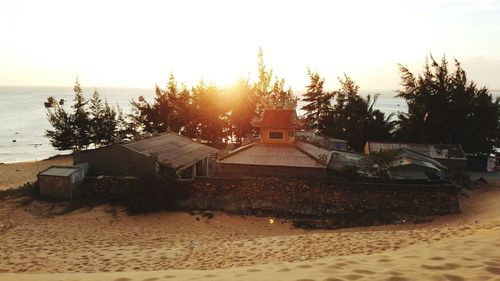 Scenic view of beach against sky during sunset