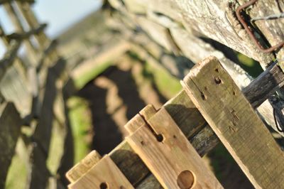 Low angle view of wooden fence