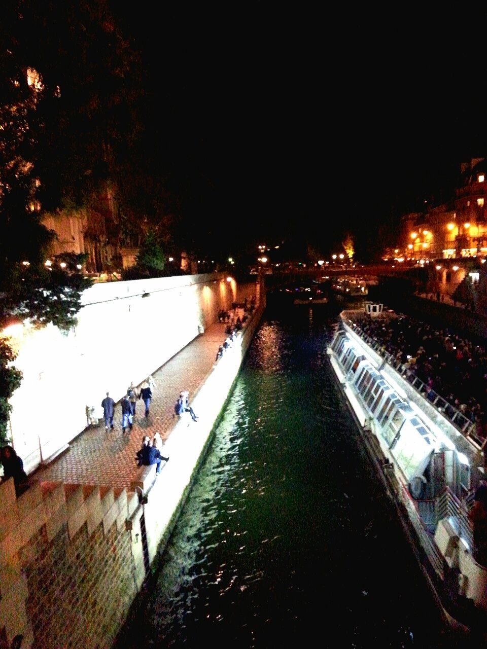 architecture, built structure, building exterior, illuminated, city, water, large group of people, night, canal, men, high angle view, street light, the way forward, lifestyles, bridge - man made structure, transportation, person, walking, city life