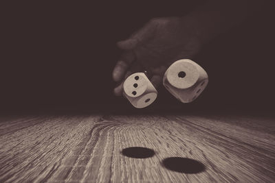 Close-up of hand playing on table