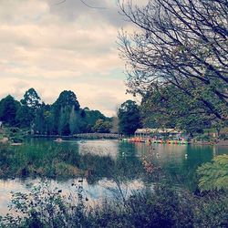 Scenic view of lake against cloudy sky