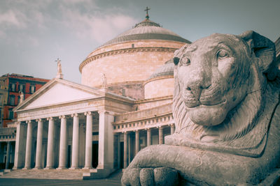 Lion statue in san francesco di paola, piazza del plebiscito, naples, italy