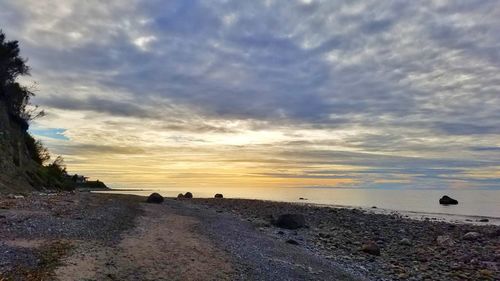 Scenic view of sea against sky at sunset