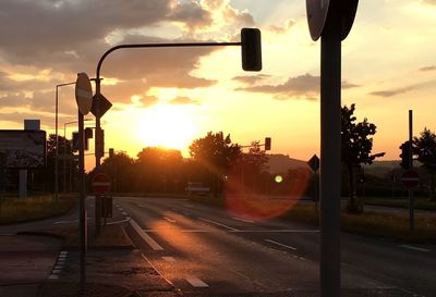 Street against sky during sunset