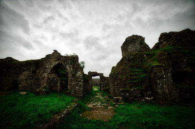 Old ruin building against cloudy sky