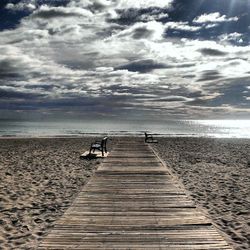 Scenic view of sea against cloudy sky