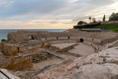 View of old ruins against sky during sunset